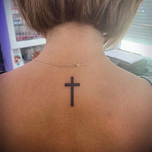 Cross tattoo at the back of your neck